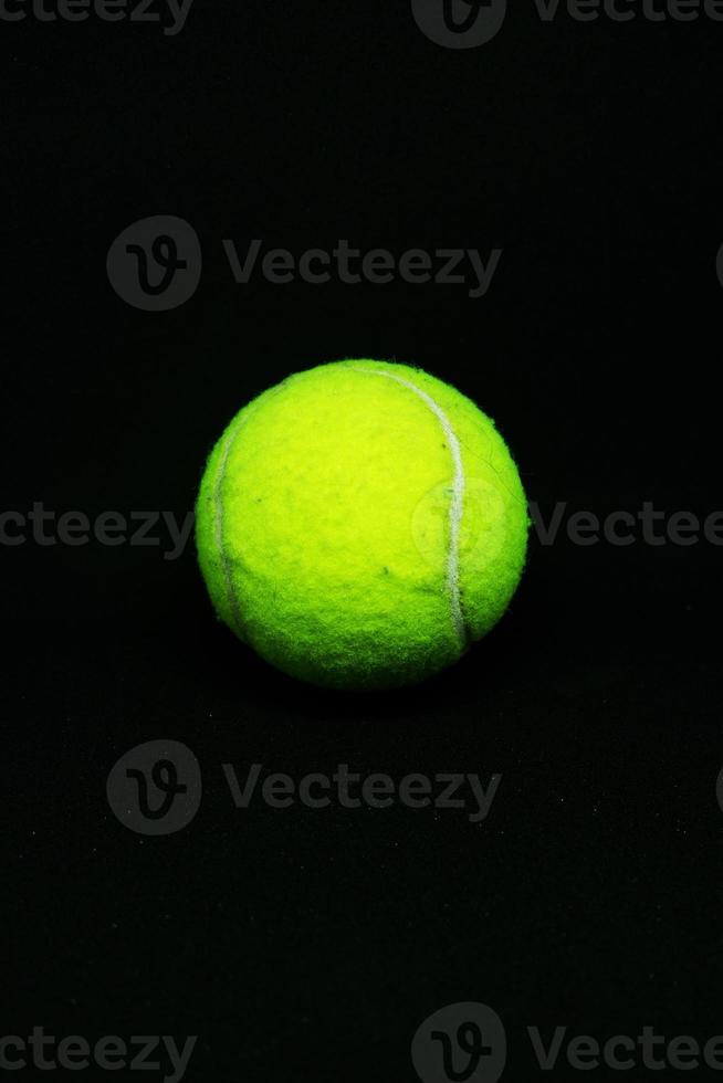 A Tennis Ball on Black Background photo
