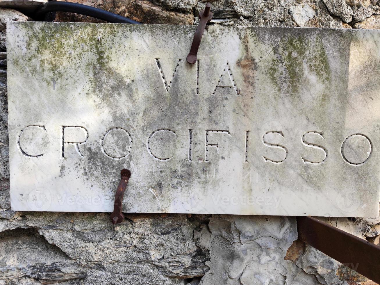 Crucifix street sign in Sant Ilario Genoa photo