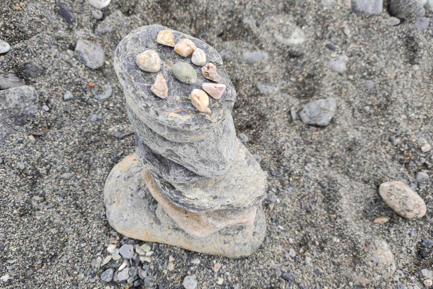 stone balancing on the beach photo