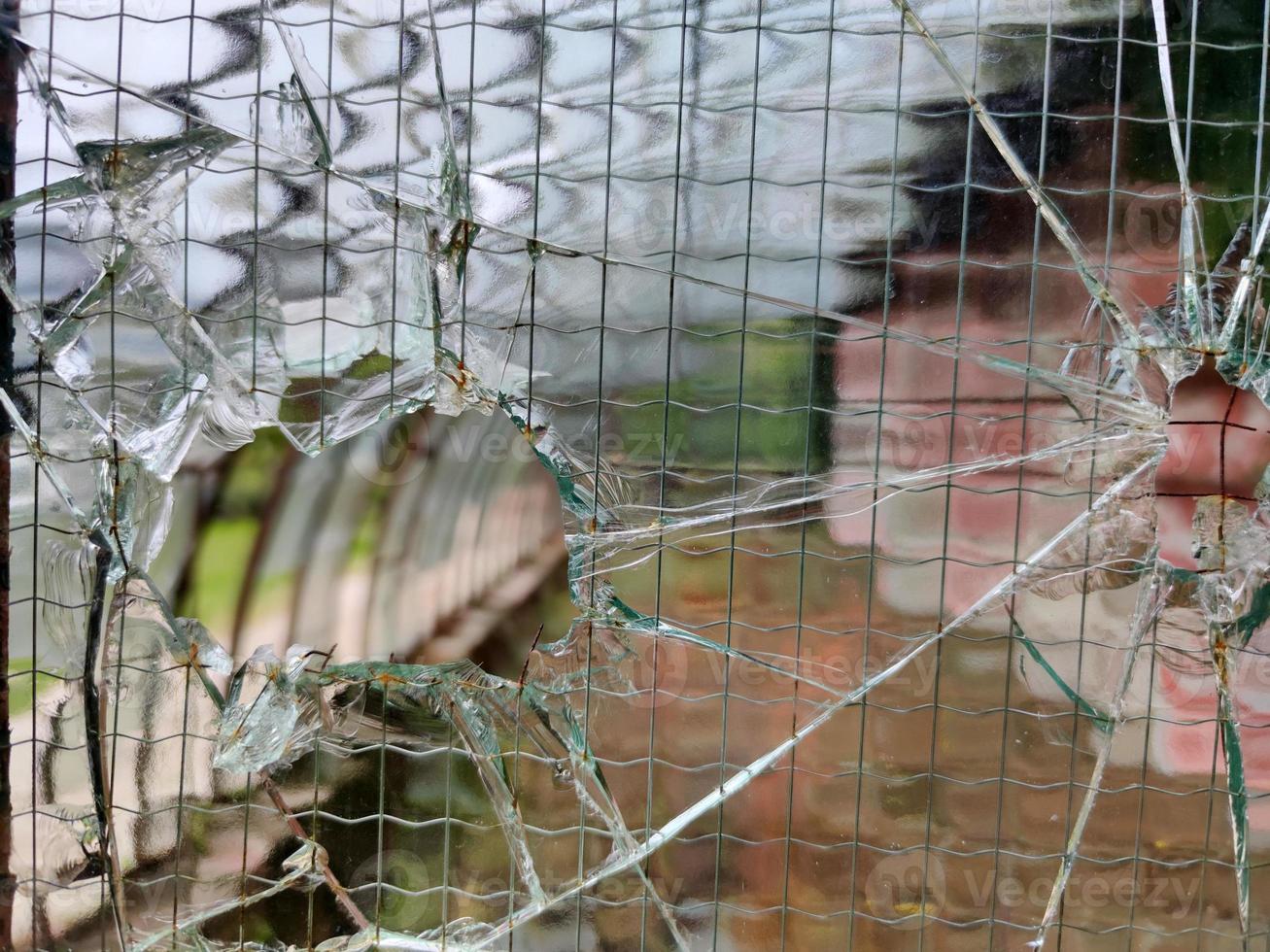 gun bullet broken window glass photo