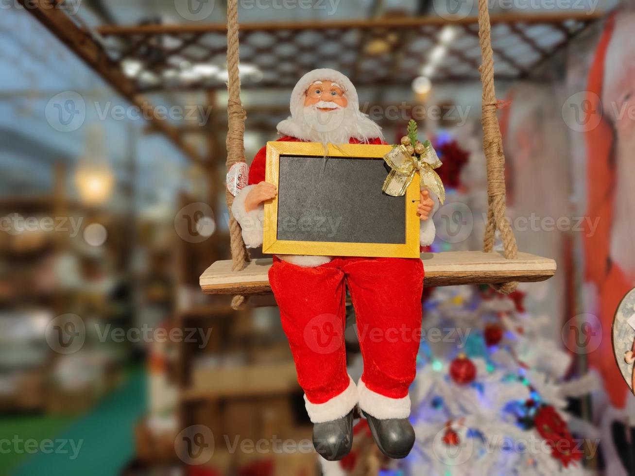 Santa Claus xmas decoration figure holding a board photo