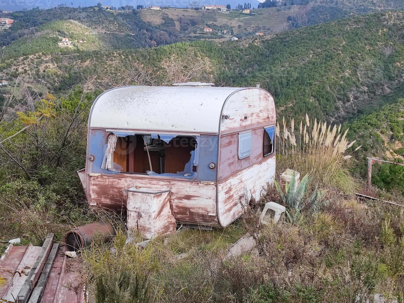 Old abandoned rusted roulotte Rv van photo