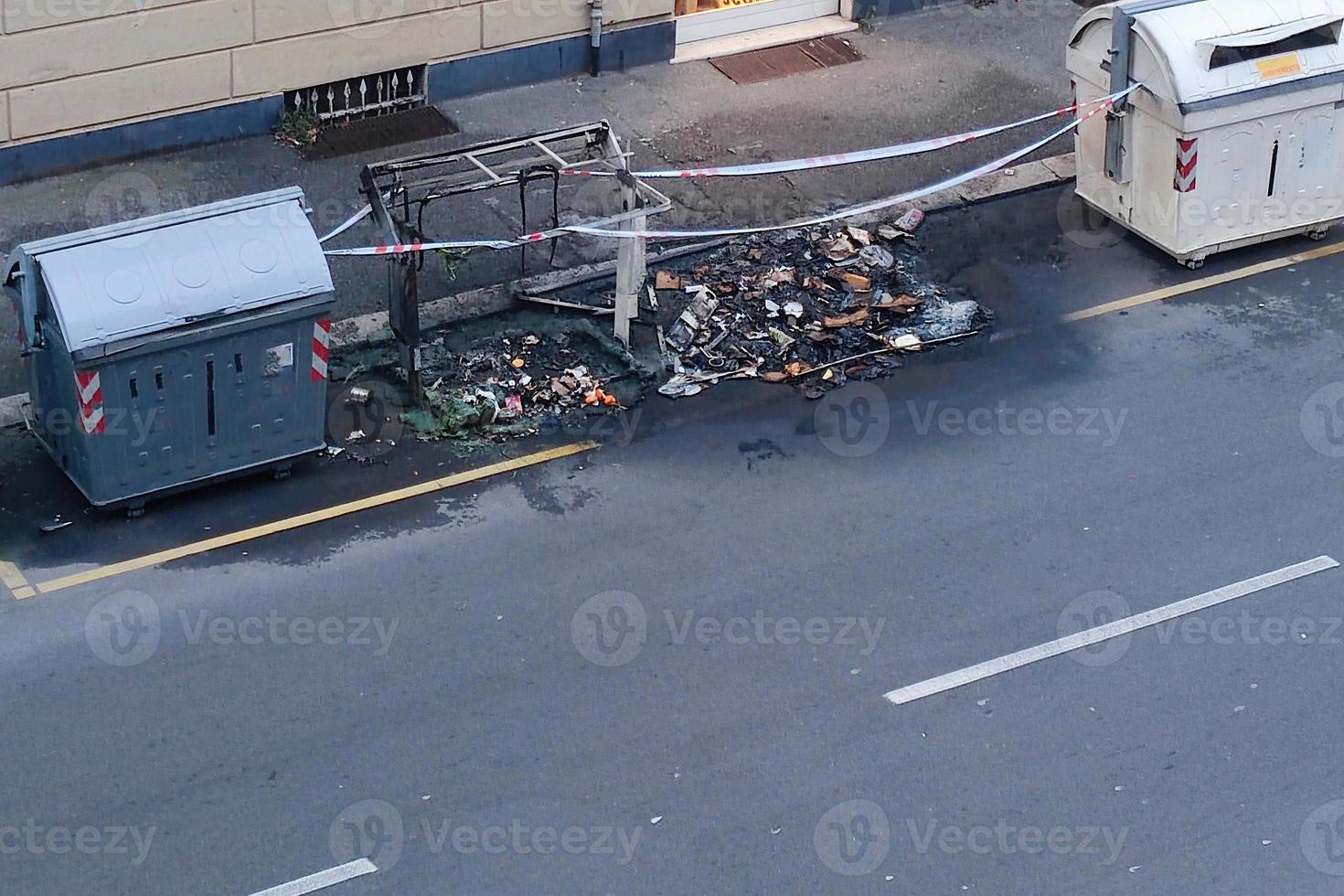 street garbage container fire burnt plastic recycle bin photo