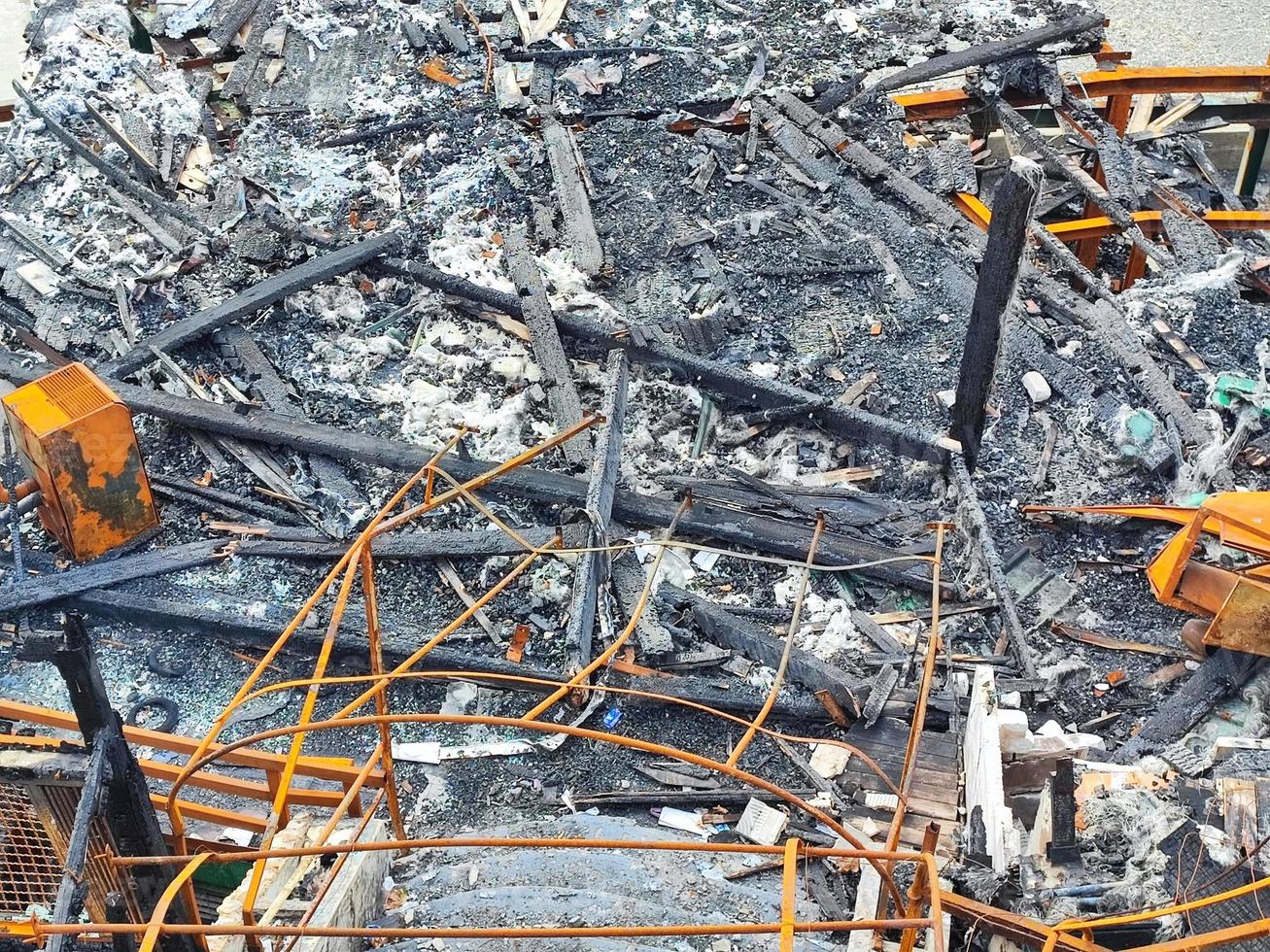 burned metal structure after fire by the sea photo