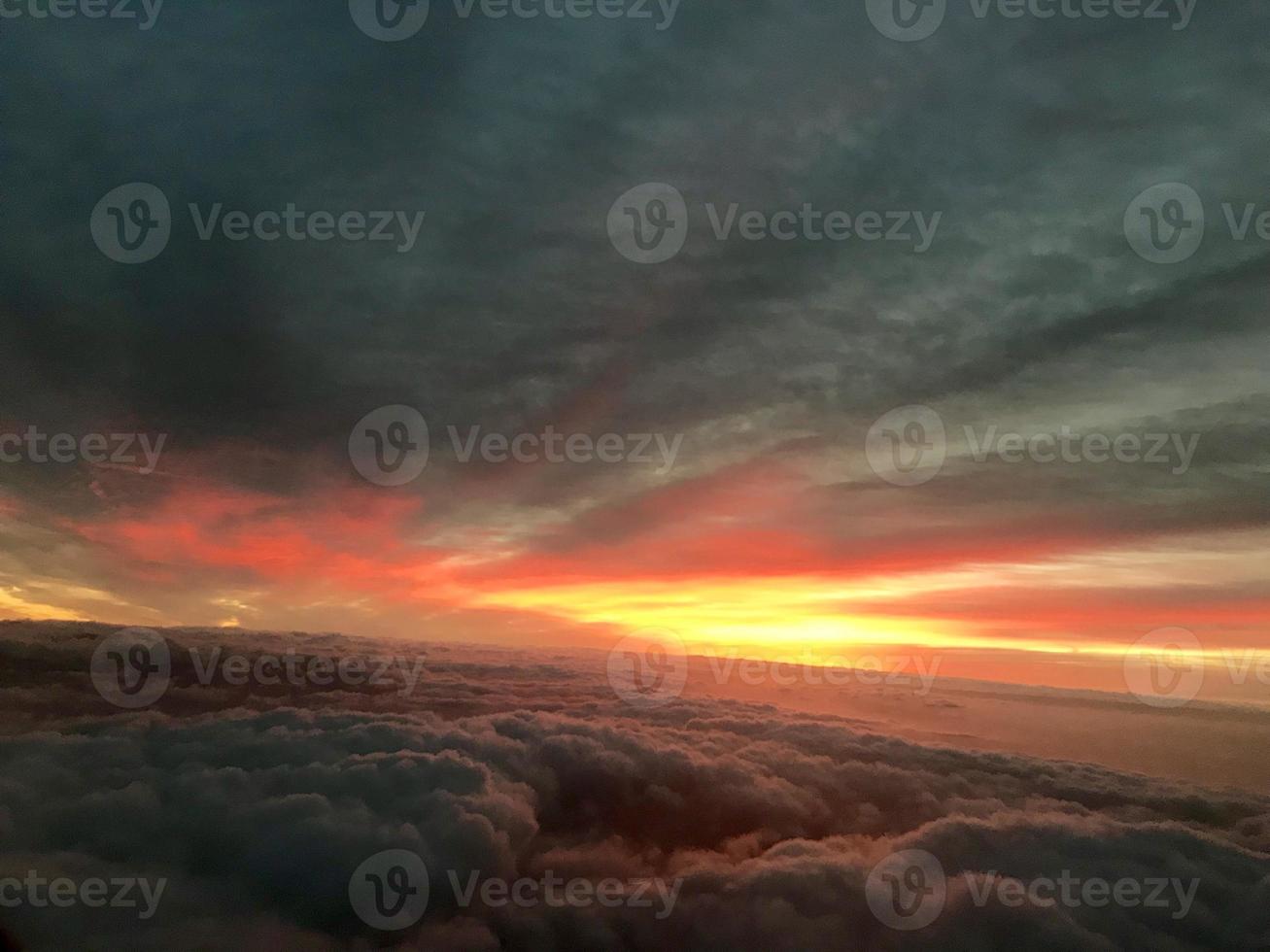 sunrise clouds in the sky from airplane window photo