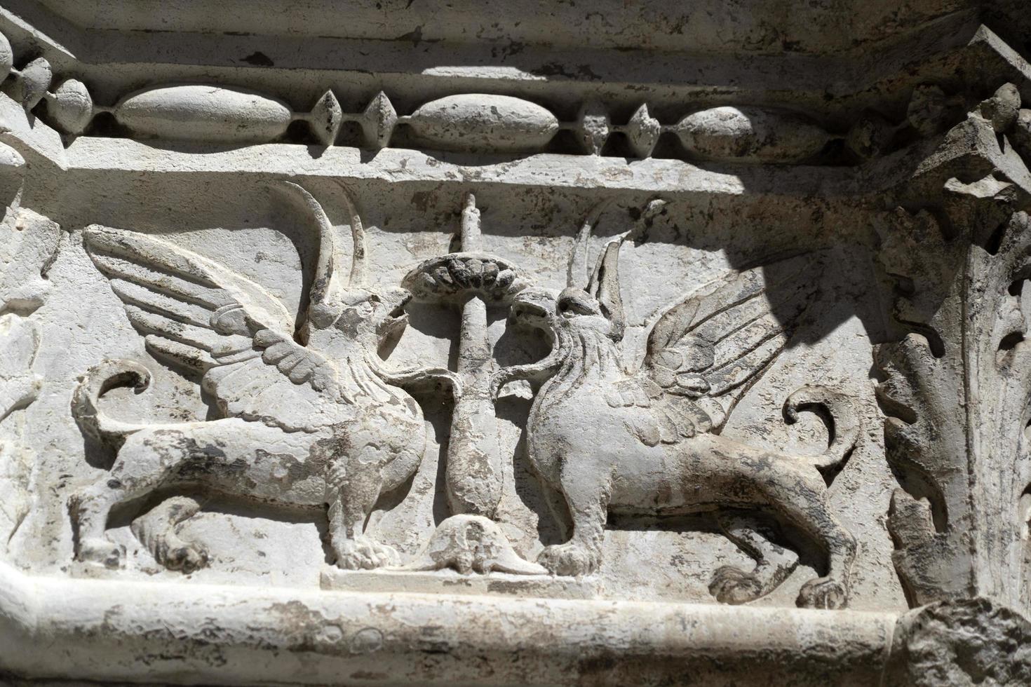 VENICE, ITALY - SEPTEMBER 15 2019 - doge ducal palace capital of column wayside sculpture detail photo