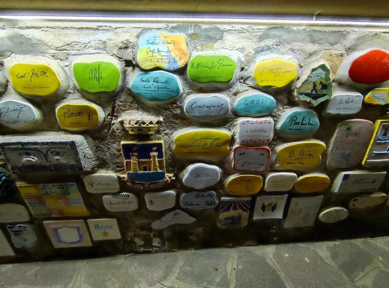 ALASSIO, ITALY - DECEMBER 13 2021 - well famous Muretto, celebrity wall at night photo