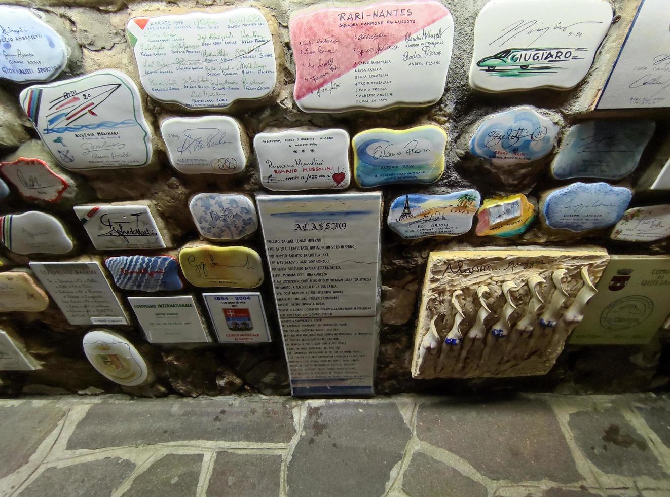 ALASSIO, ITALY - DECEMBER 13 2021 - well famous Muretto, celebrity wall at night photo