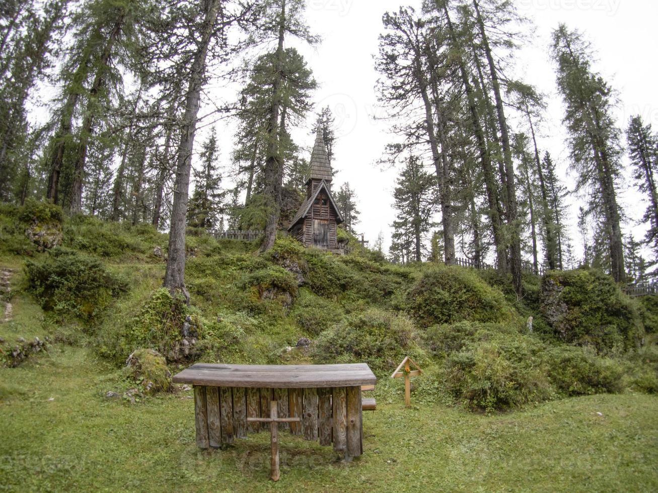 I world war old wood church and cemetery in dolomites valparola photo