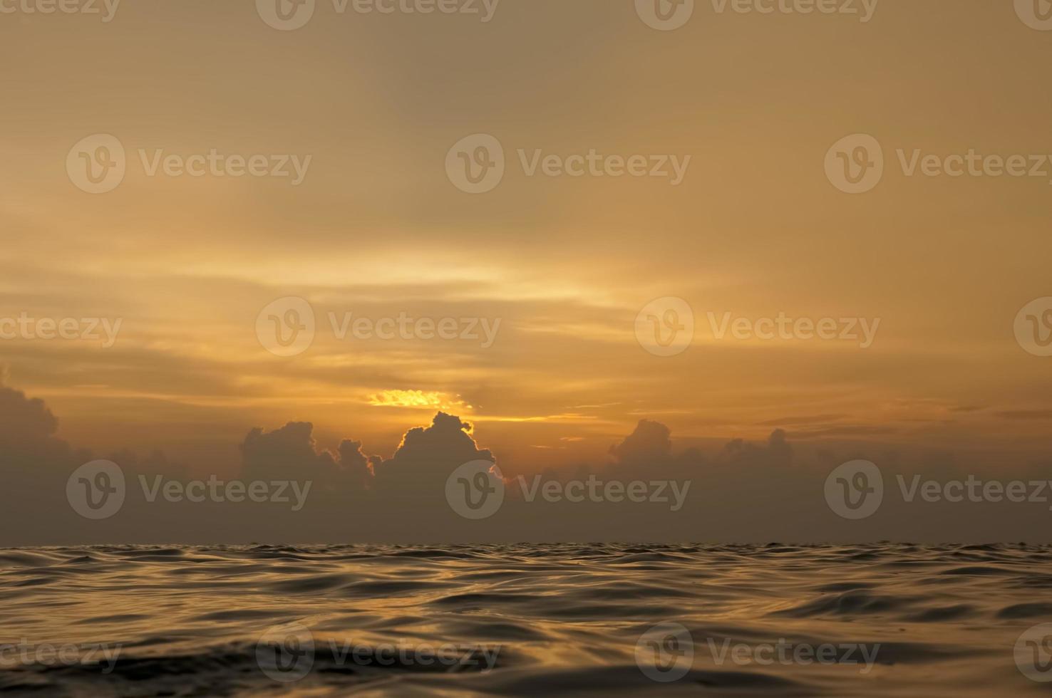 A colorful sunset in the middle of indian ocean in Maldives photo