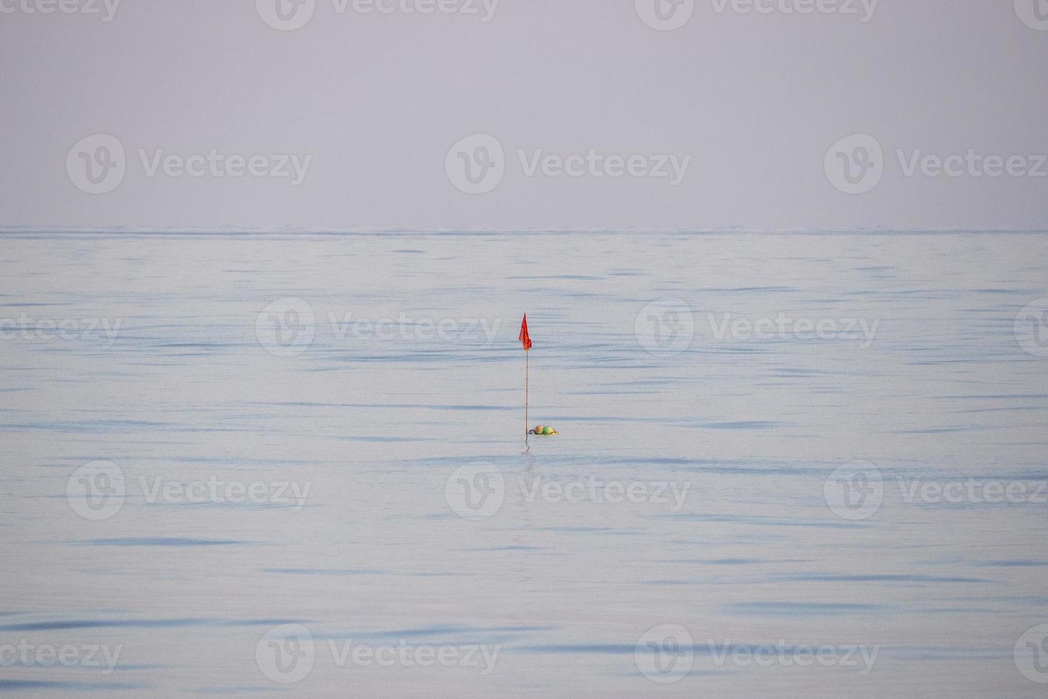 fishing net buoy in the middle of mediterranean sea photo