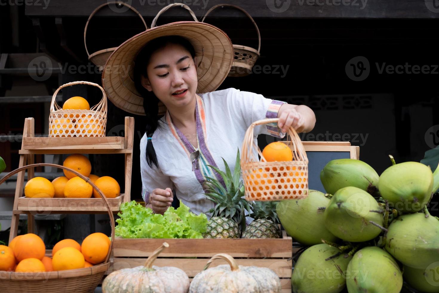 Native Asia woman selling fruits at the farm stay, Homestay at Thailand Loei photo