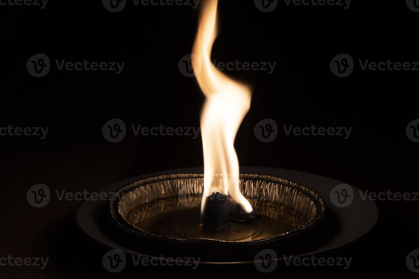 red flame on black background photo