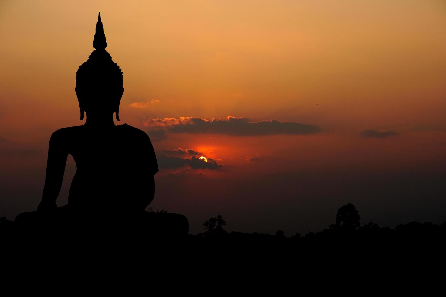 big buddha silhouette sunset background.Makha Bucha Day.Vesak Day.Asanha Bucha.Buddhist Lent. photo