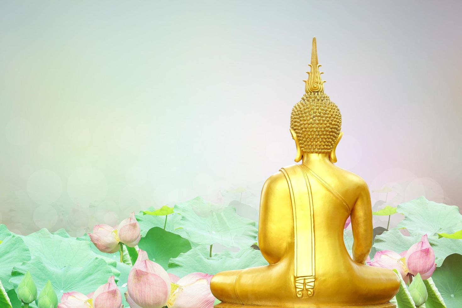 Makha Asanaha Visakha Bucha Day Golden Buddha image. Background of Bodhi leaves with shining light. Soft image and smooth focus style photo