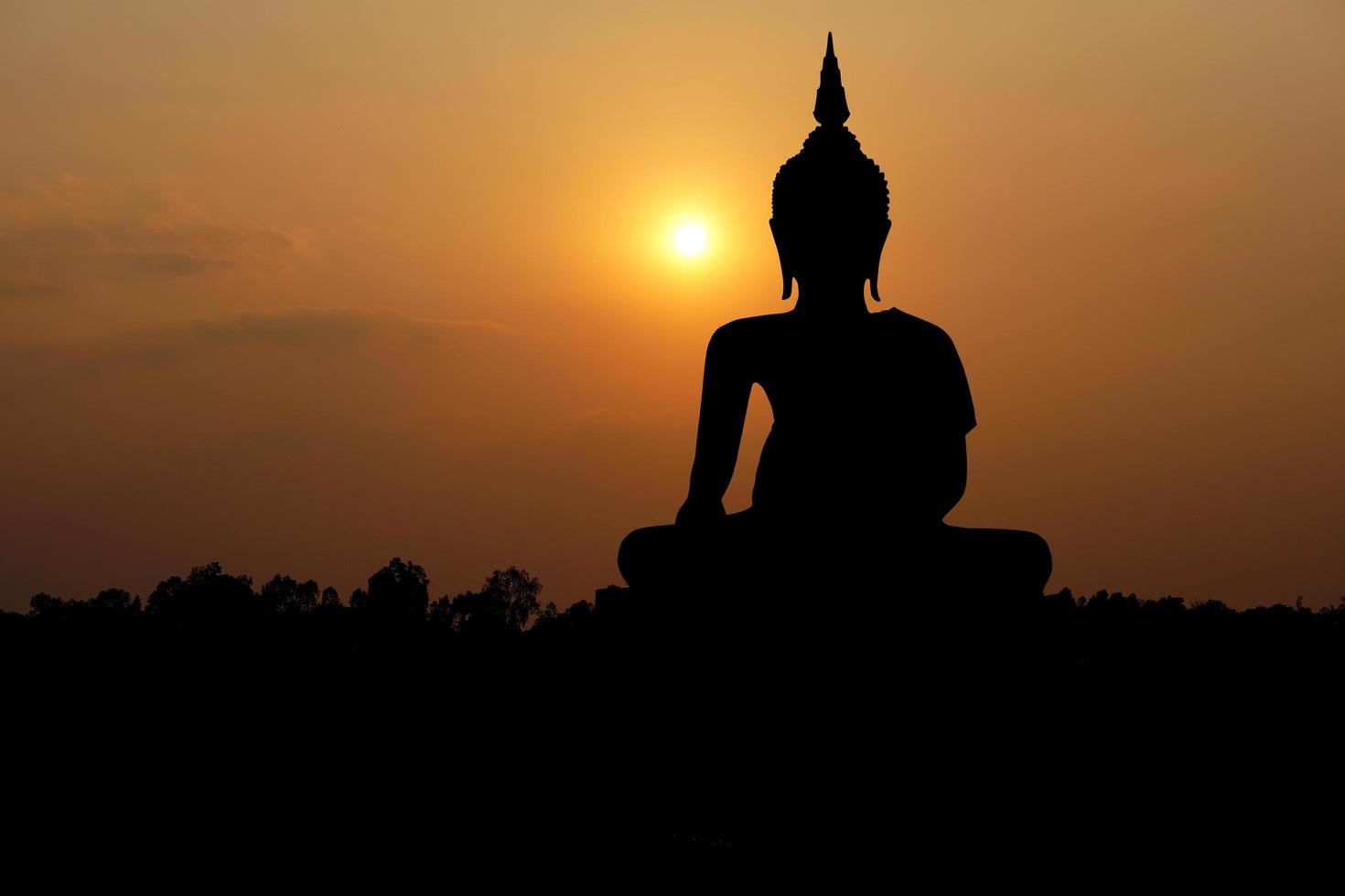 big buddha silhouette sunset background.Makha Bucha Day.Vesak Day.Asanha Bucha.Buddhist Lent. photo