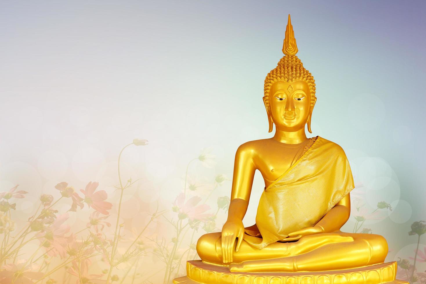 Makha Asanaha Visakha Bucha Day Golden Buddha image. Background of Bodhi leaves with shining light. Soft image and smooth focus style photo