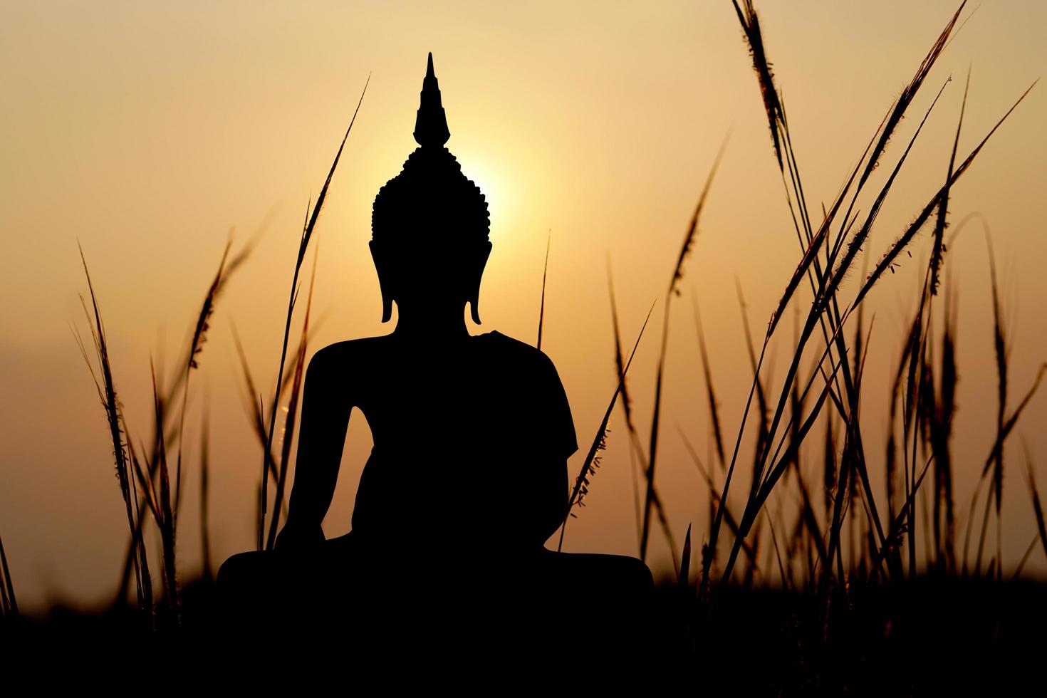 big buddha silhouette sunset background.Makha Bucha Day.Vesak Day.Asanha Bucha.Buddhist Lent. photo