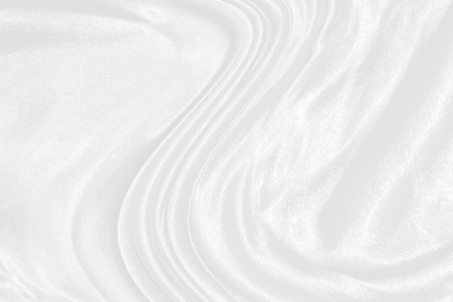 white silk textured cloth background,Closeup of rippled satin fabric with soft waves. photo