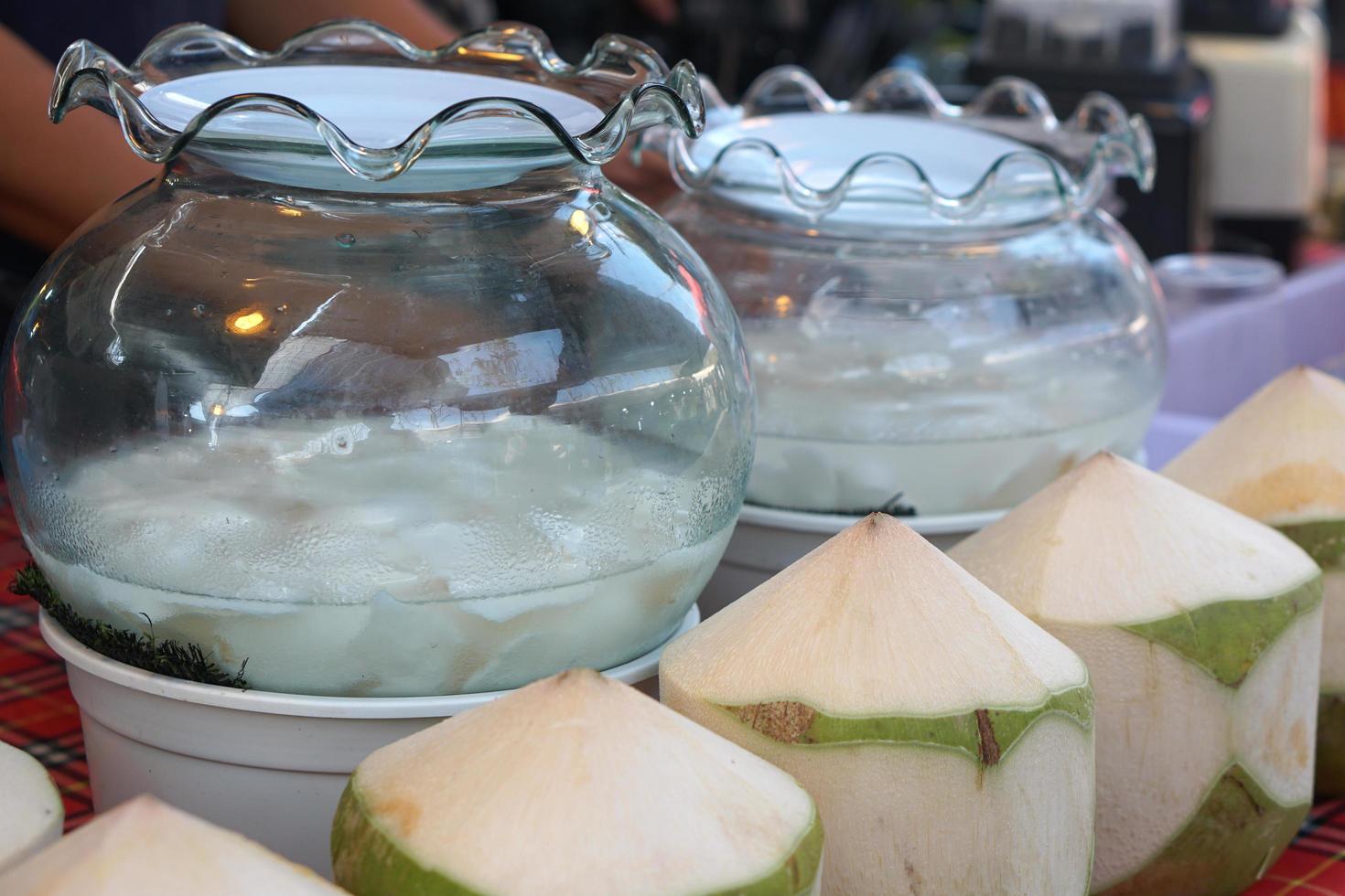 Coconut water is sold in the market. photo
