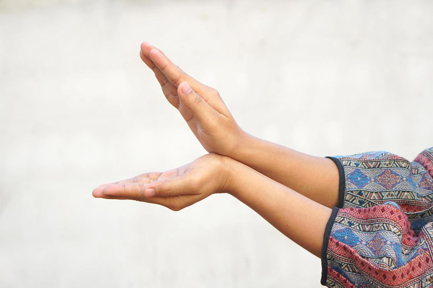 A human hand sticks out to form a shark. photo