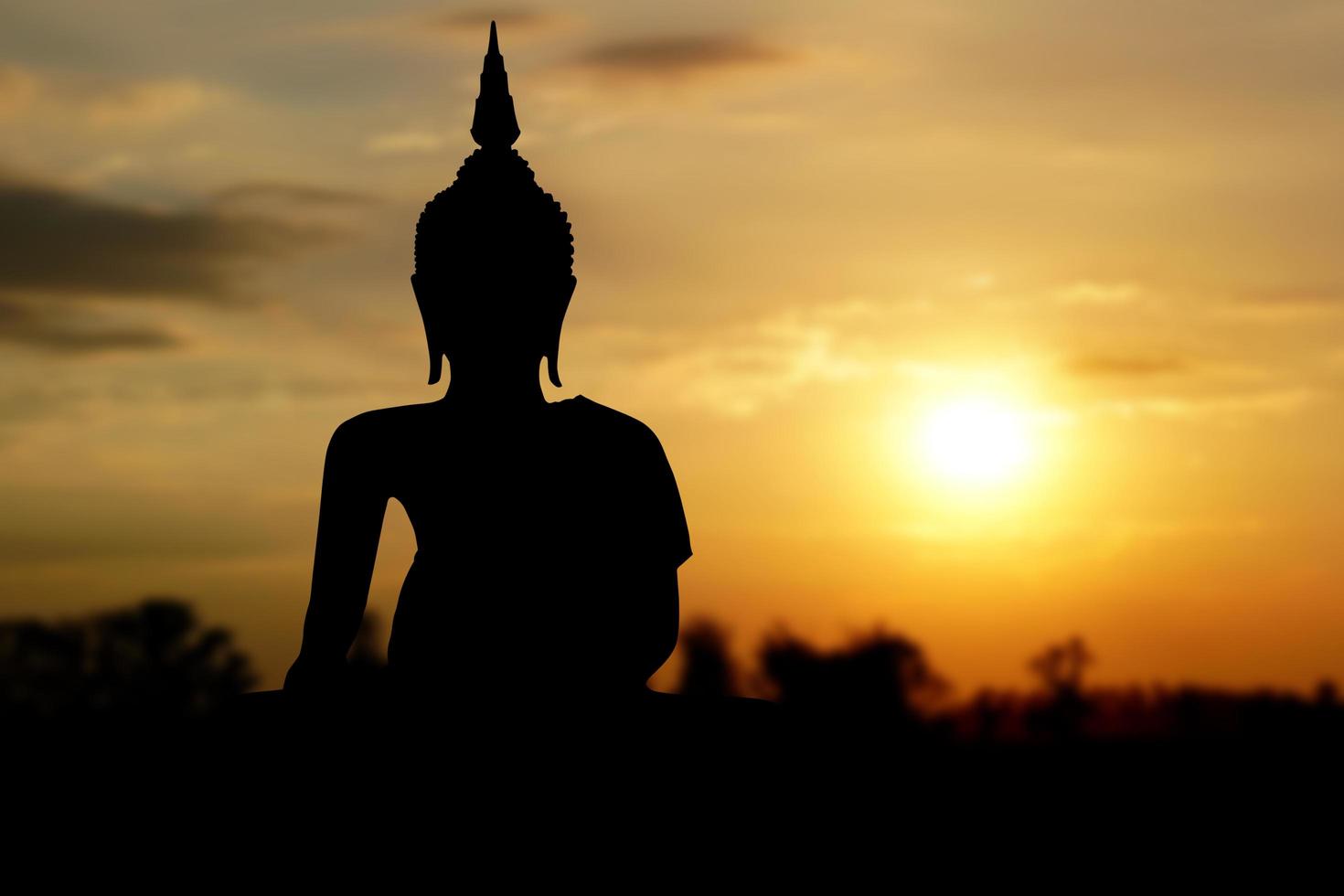 big buddha silhouette sunset background.Makha Bucha Day.Vesak Day.Asanha Bucha.Buddhist Lent. photo