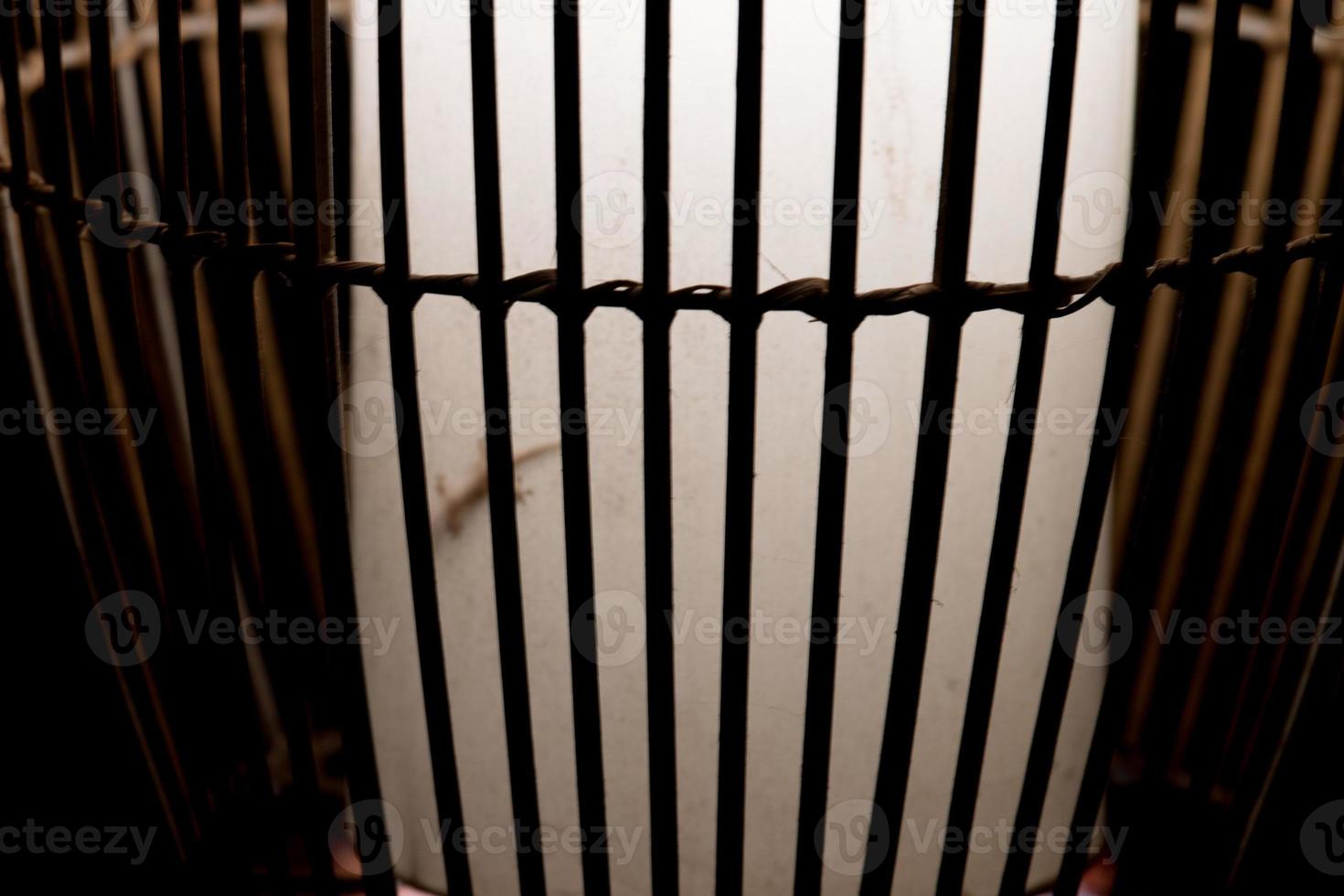 light behind cage bars photo