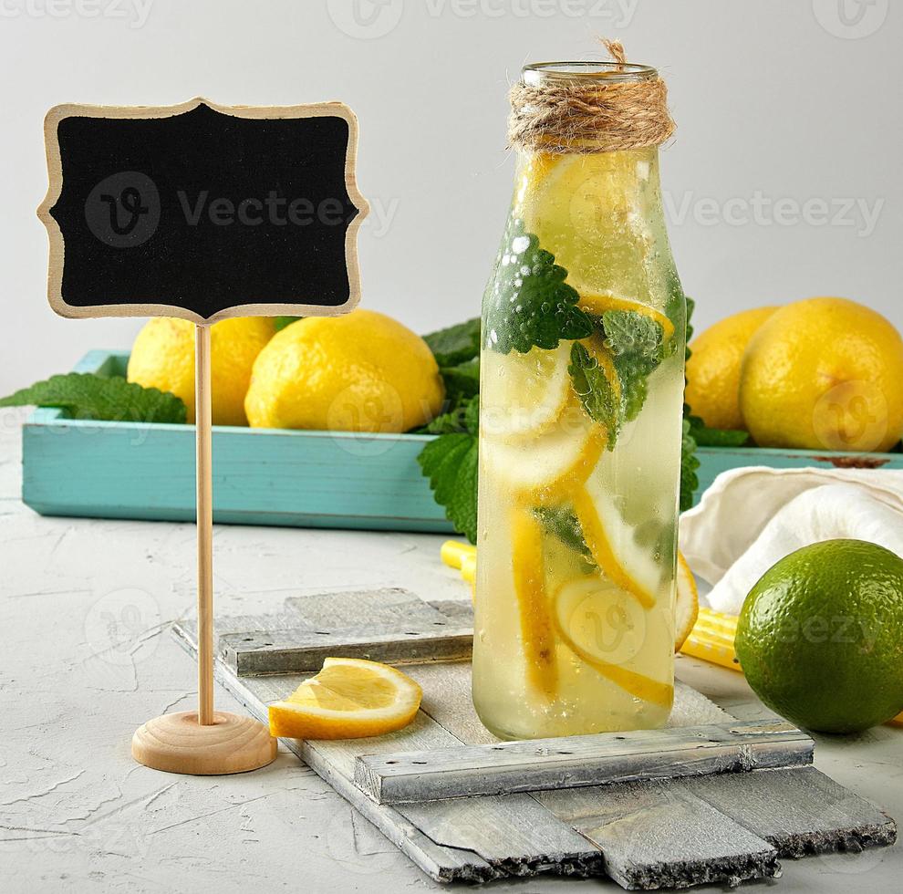 summer refreshing drink lemonade with lemons photo