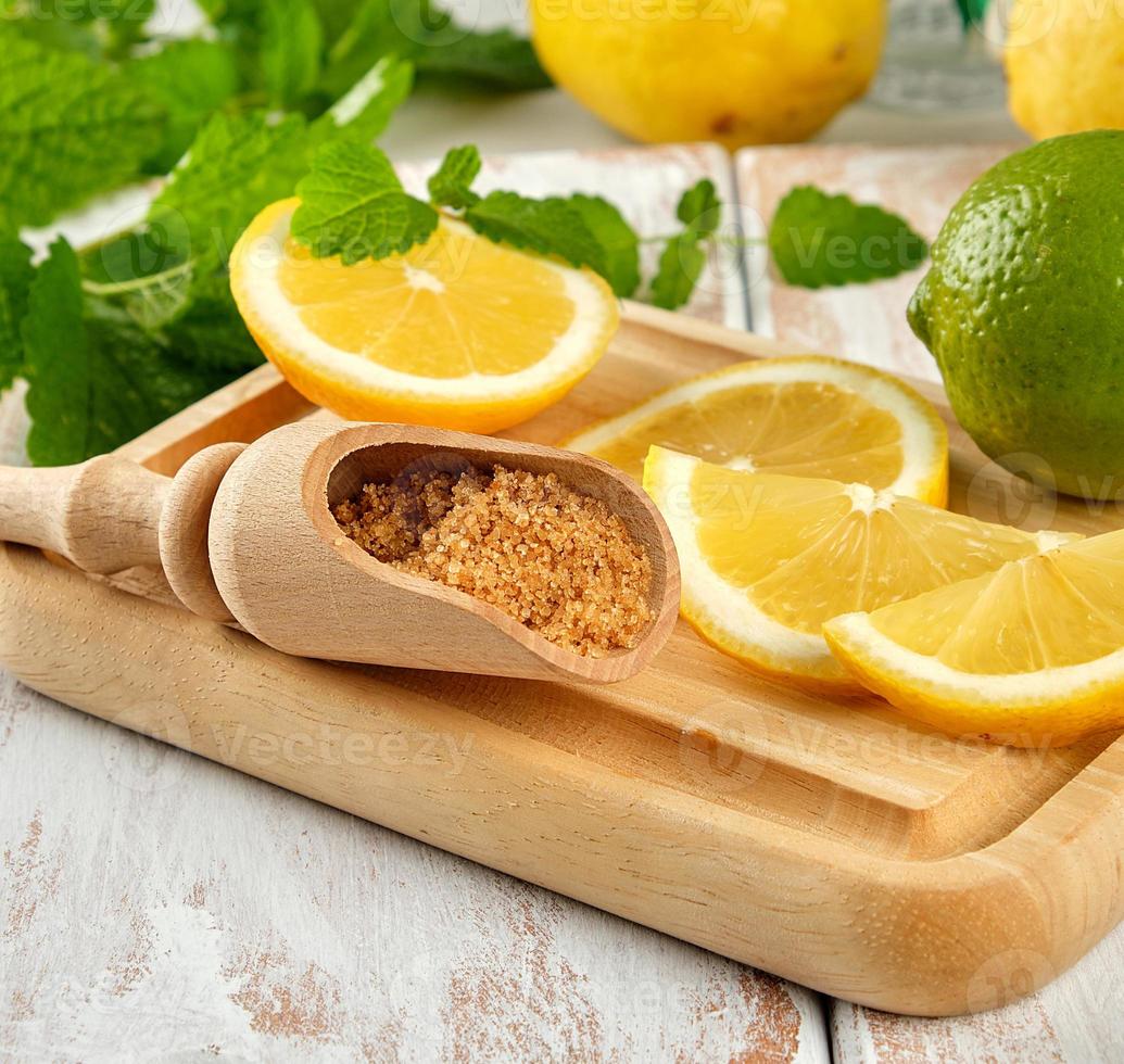 yellow lemons and lime, brown sugar and fresh mint 20204666 Stock Photo at Vecteezy