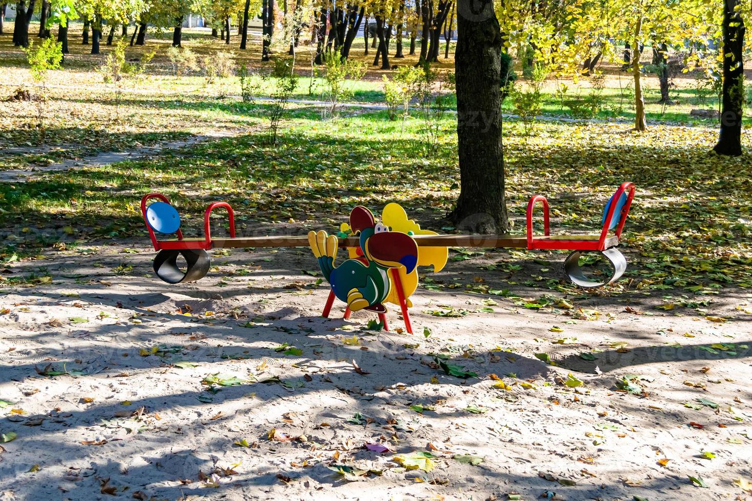 Photography on theme empty playground with metal swing for kids photo