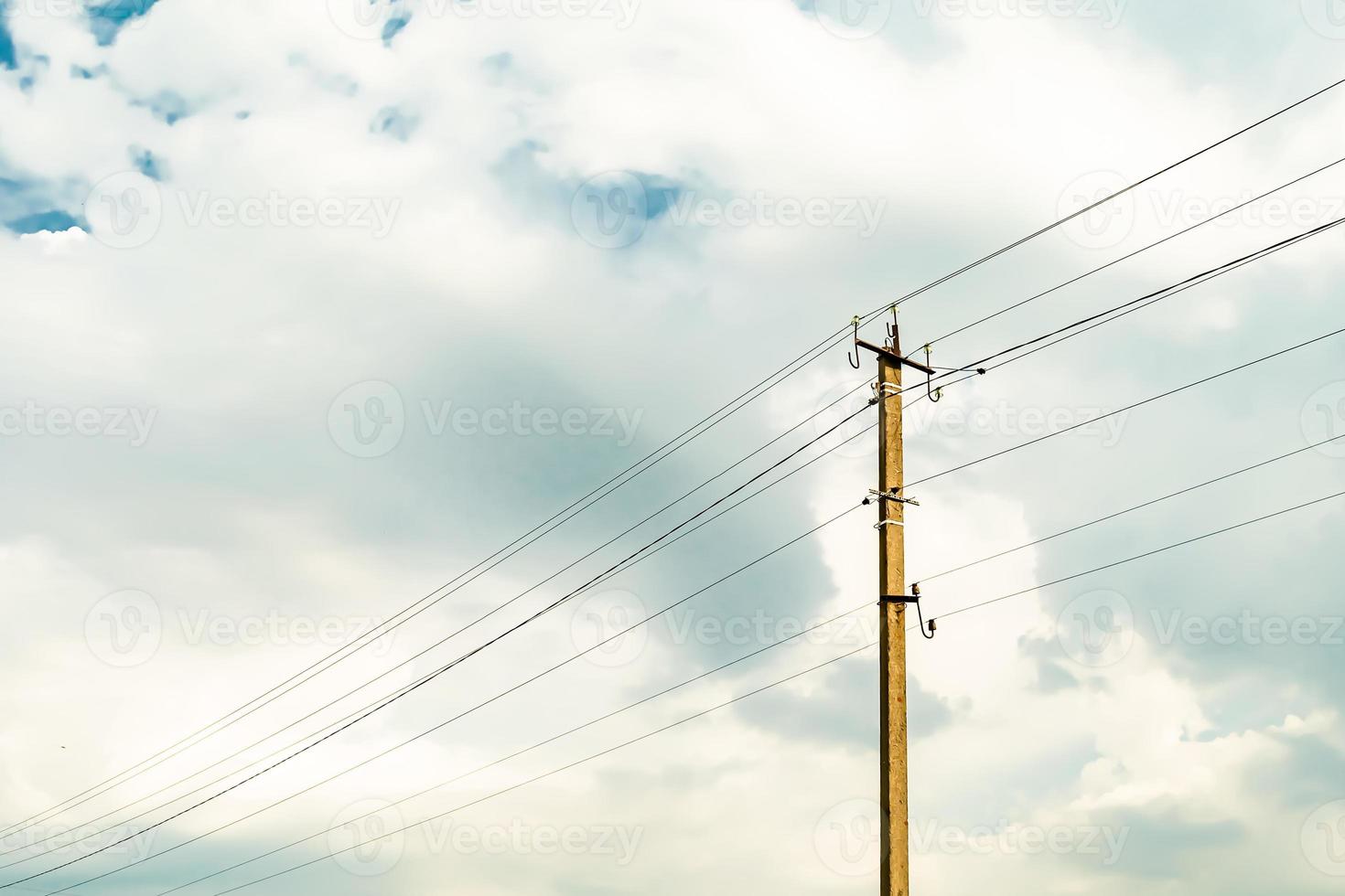 Power electric pole with line wire on colored background close up photo