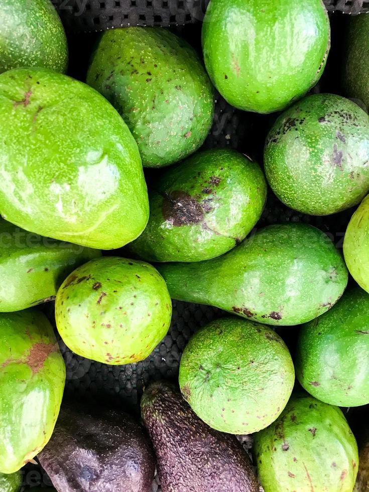 Avocado or alpukat sold at a supermarket taken from a top view angle photo