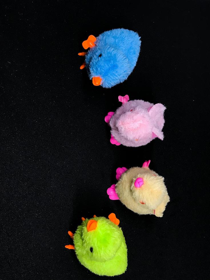 Toys and dolls isolated on black background photo