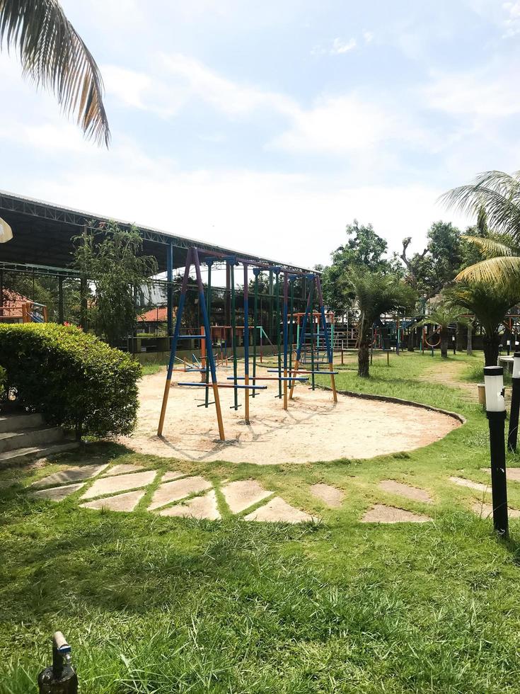 The play park for children is wrapped in red barrier tape. Outside. photo