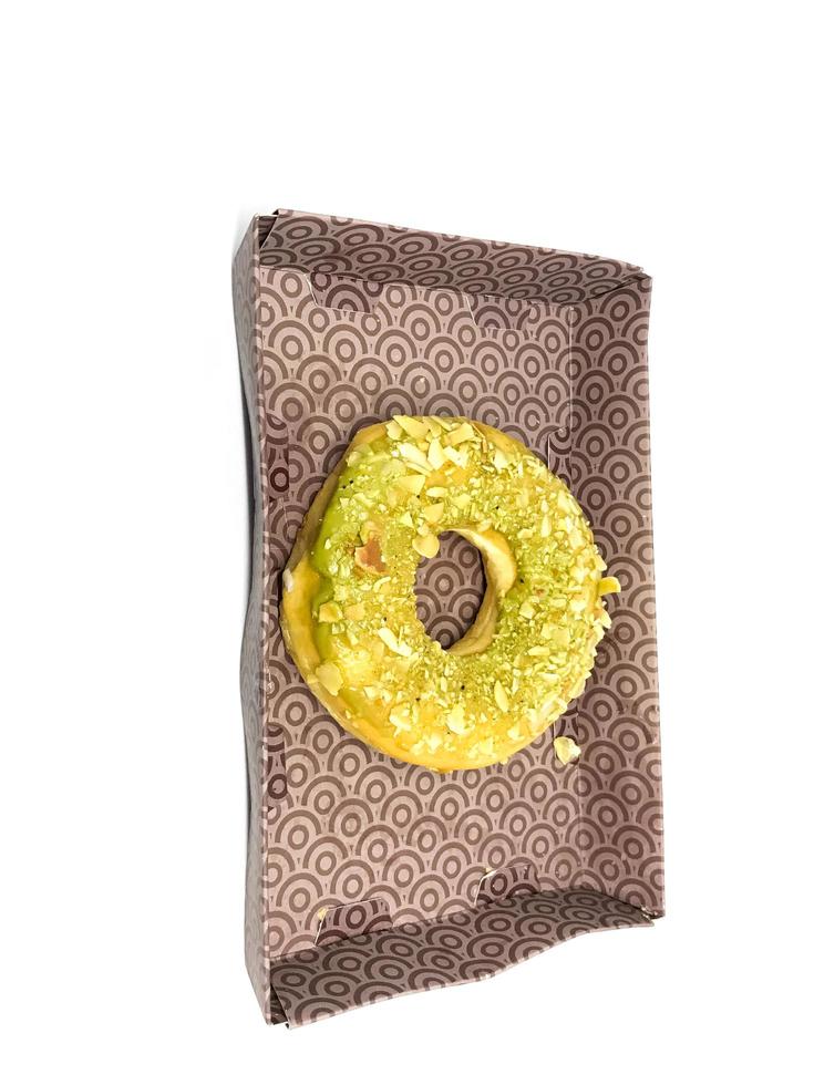donut with green tea sprinkles isolated on white background photo