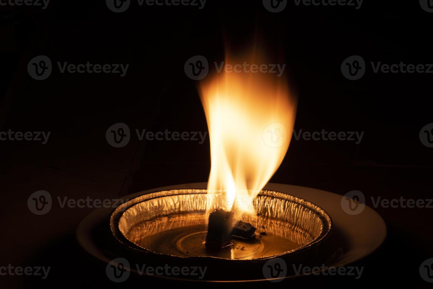 red flame on black background photo