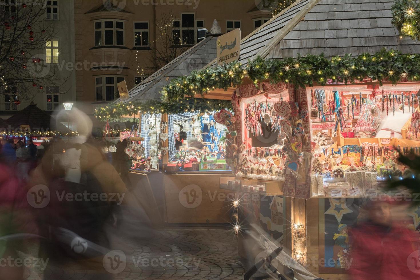 TRENTO, ITALY - DECEMBER 1, 2015 - People at traditional xmas market photo