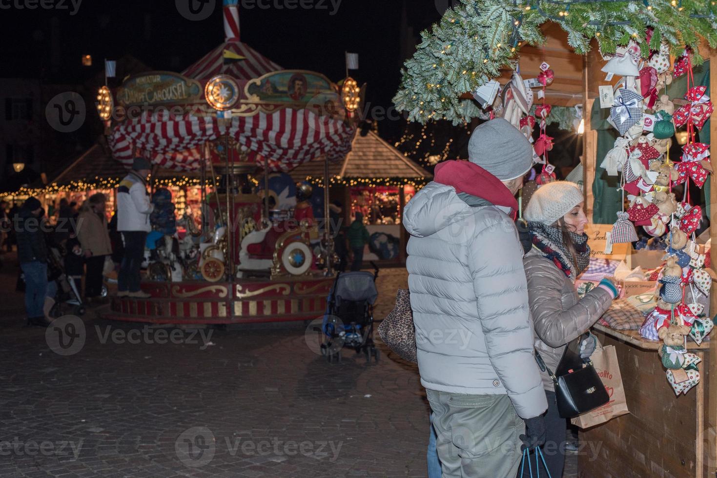 TRENTO, ITALY - DECEMBER 1, 2015 - People at traditional xmas market photo