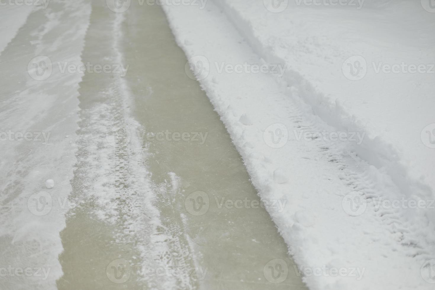Ice in snow. Ice in hockey stadium. Texture of snow. photo
