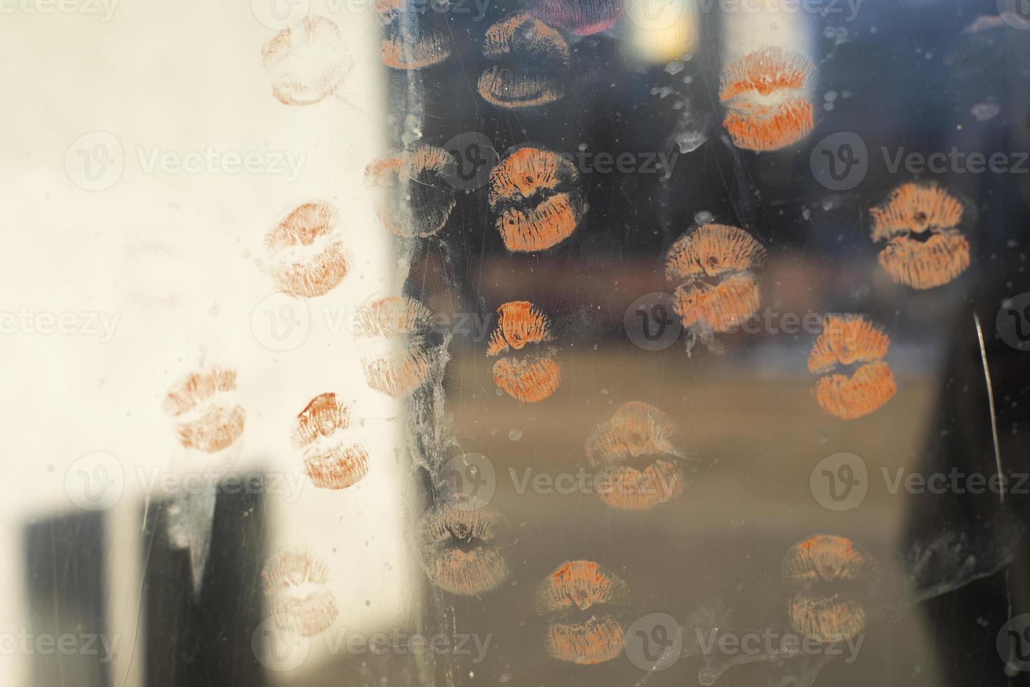 Lipstick marks on mirror. Lots of kisses on glass. 20211043 Stock Photo