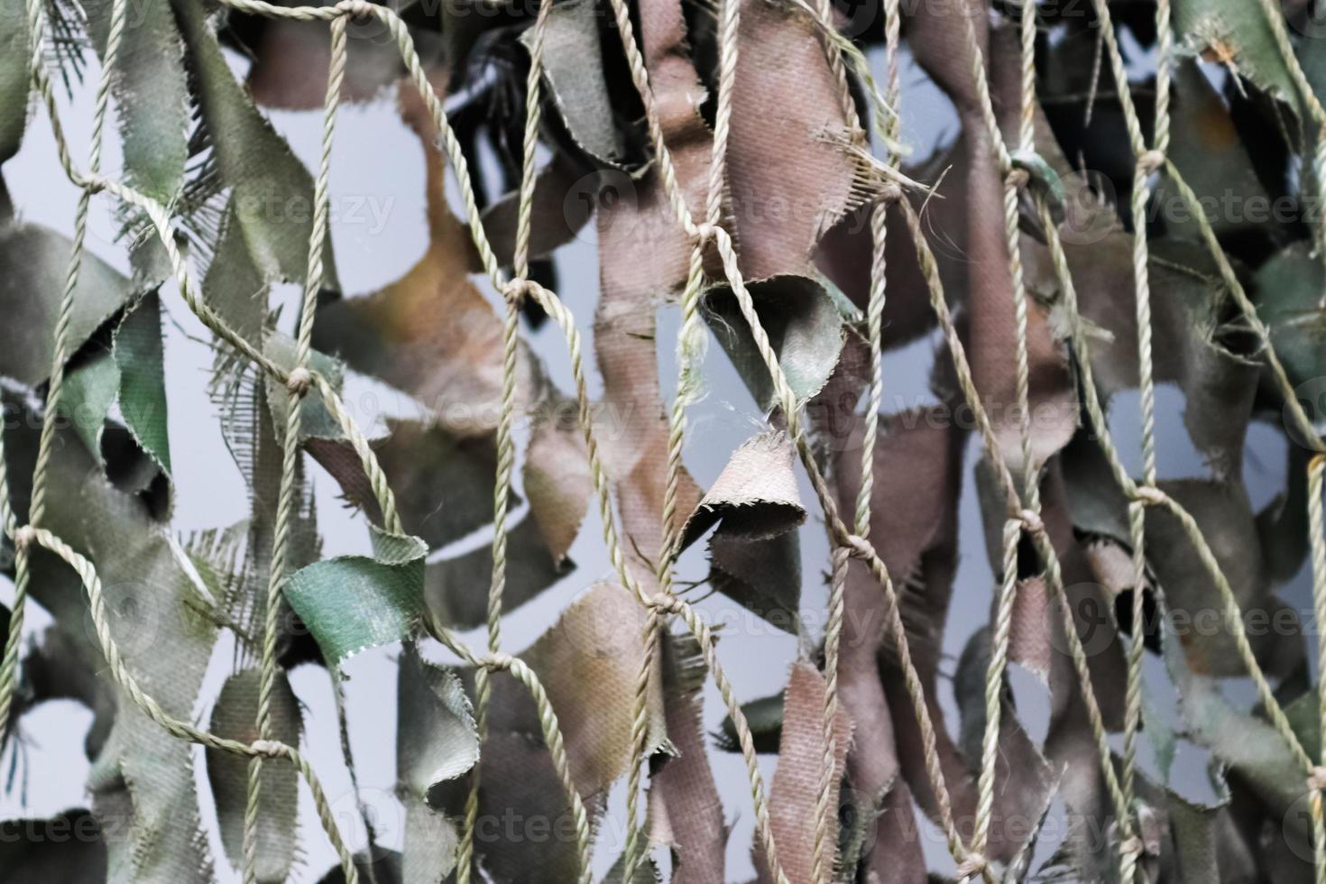 Close-up of a camouflage net for military use - background texture. photo
