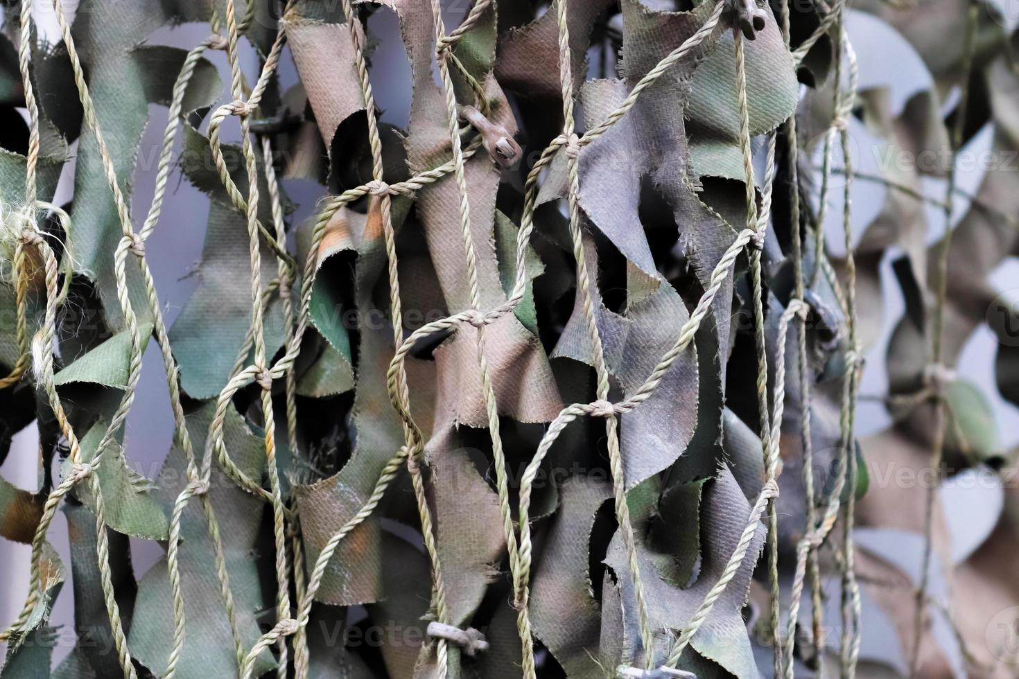 Close-up of a camouflage net for military use - background texture. photo