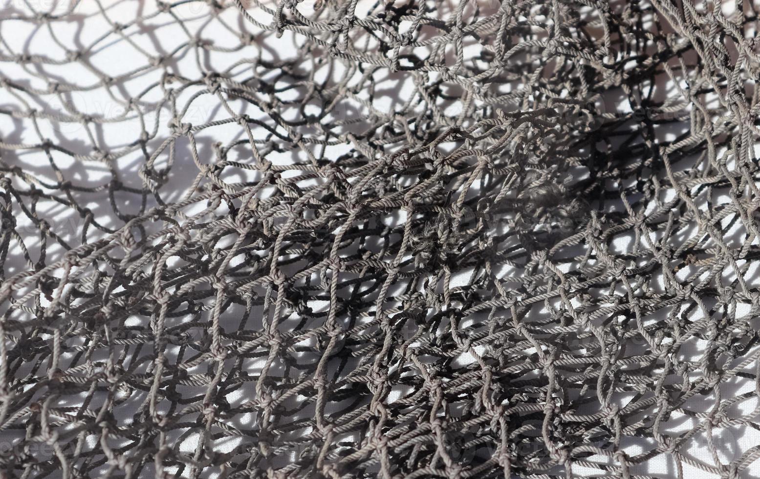 Close-up of a camouflage net for military use - background texture. photo