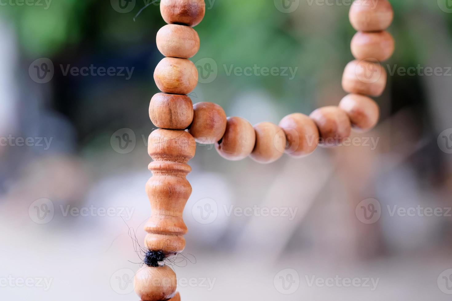 Wooden prayer beads on a blurred background. Macro shot photo