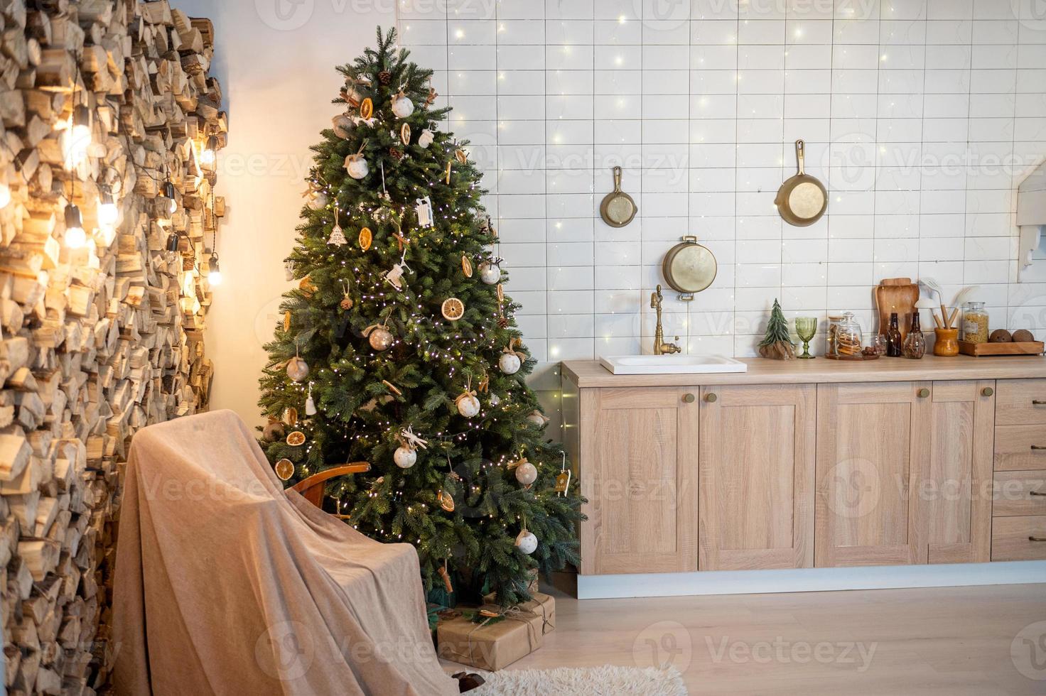 New Year's kitchen interior with a Christmas tree and a rocking chair photo