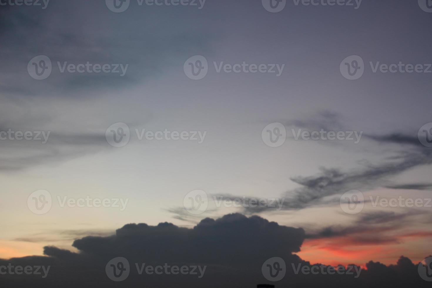 sunset dark blue cloud with white golden light sky background and city light midnight evening time photo