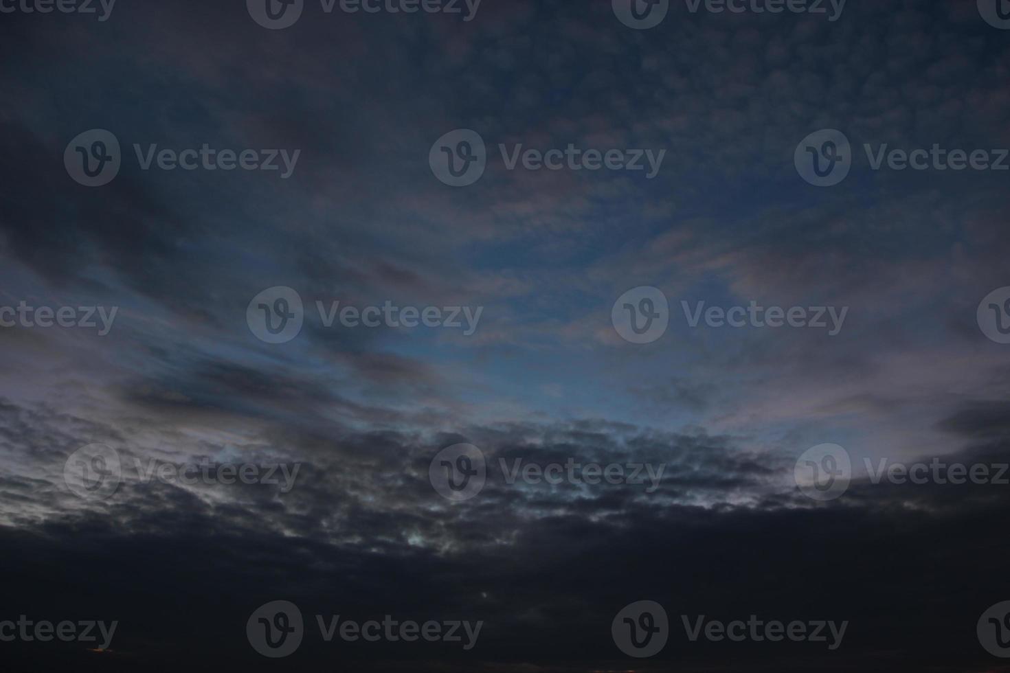 dark blue cloud with white light sky background and city light midnight evening time photo