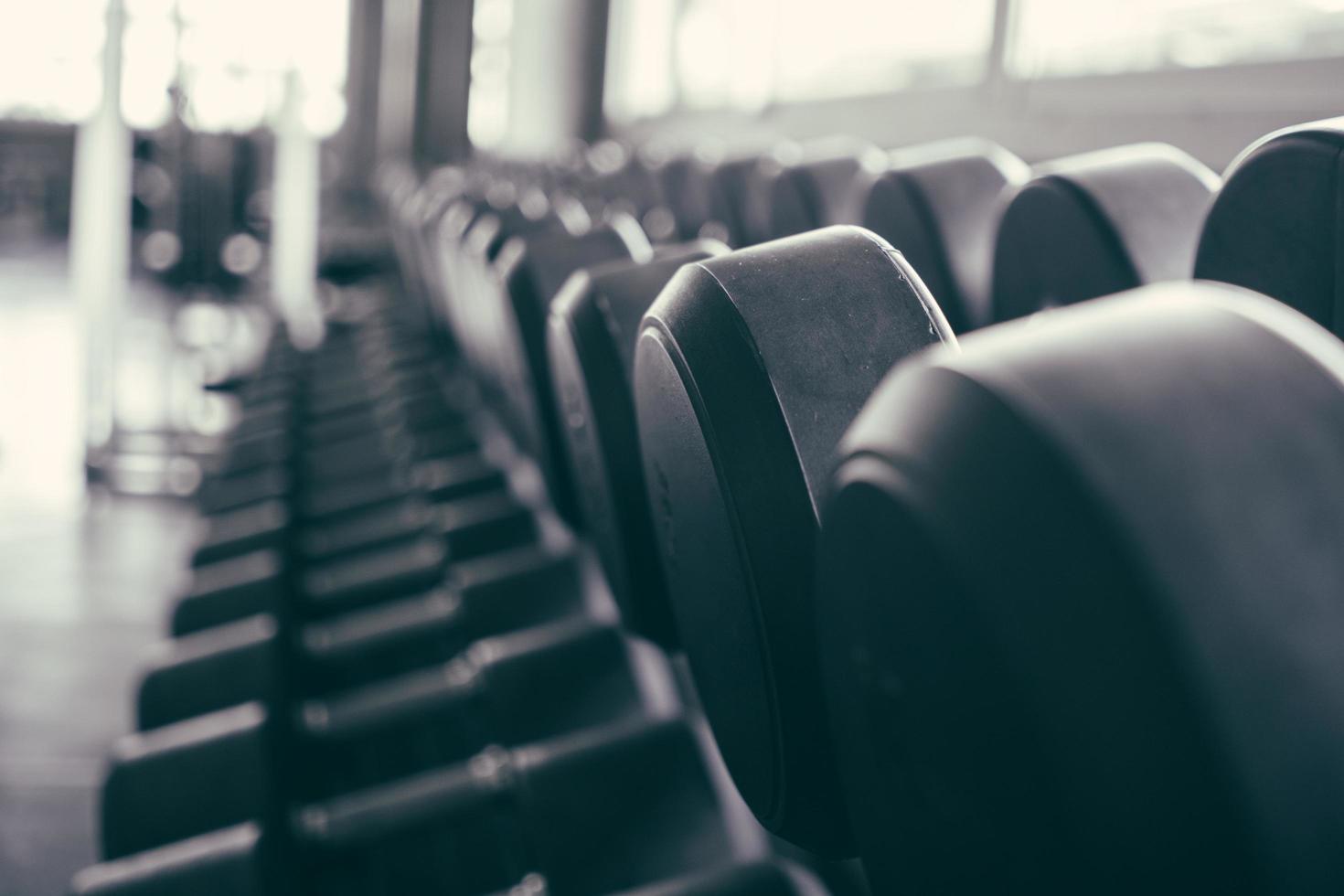 Row of dumbbells  background in the fitness photo