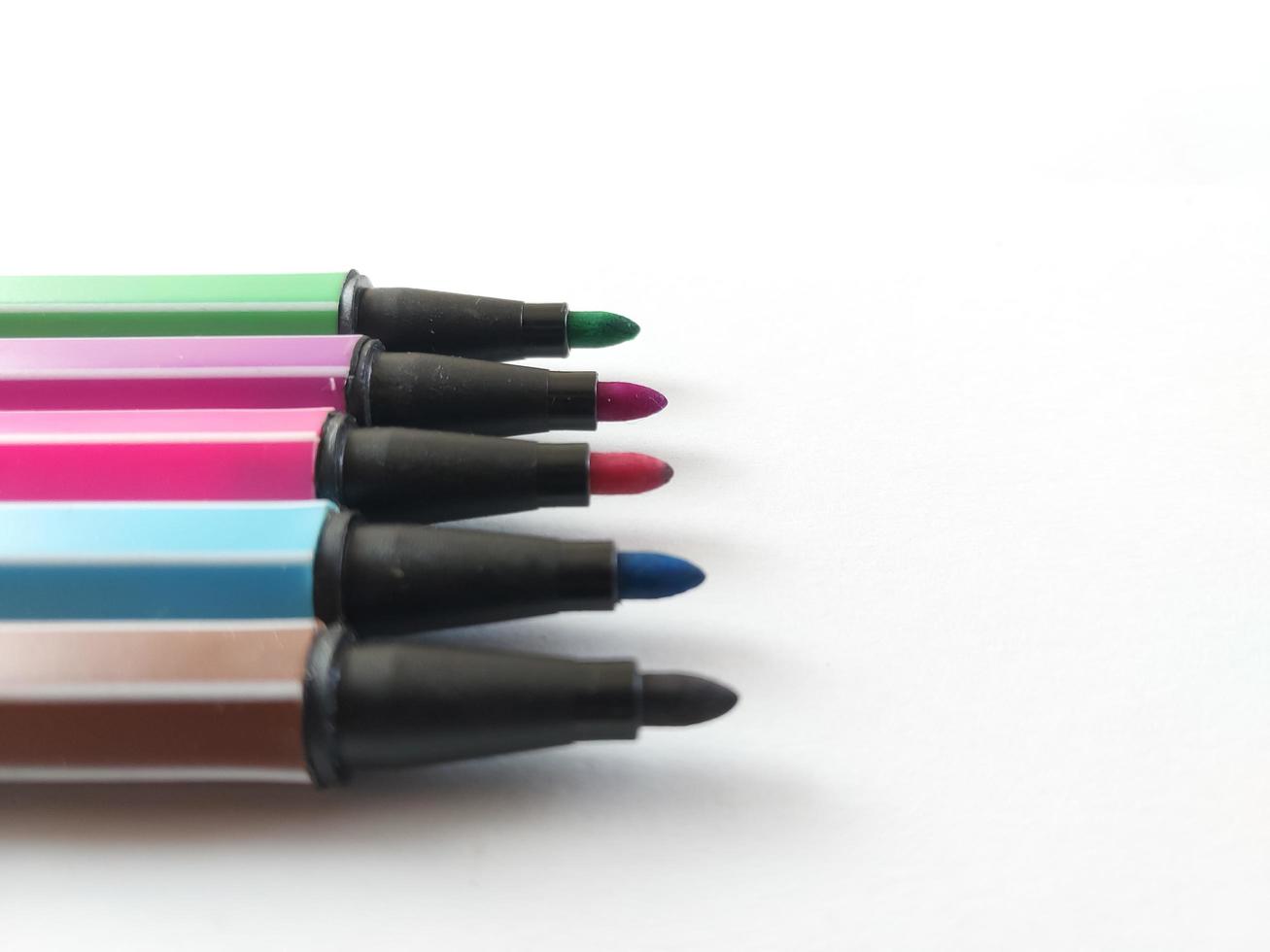 colorful markers isolated on white background photo