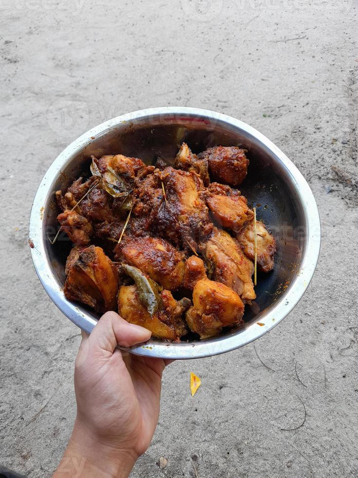 chicken cooked with typical Indonesian spices that are collected in one basin photo